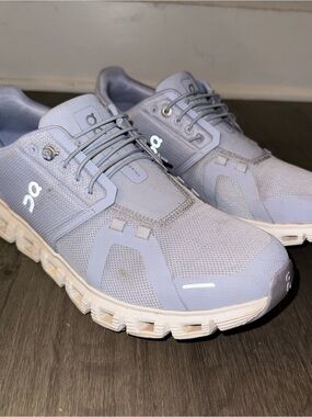 On Running woman’s Athletic Shoes in purple and white